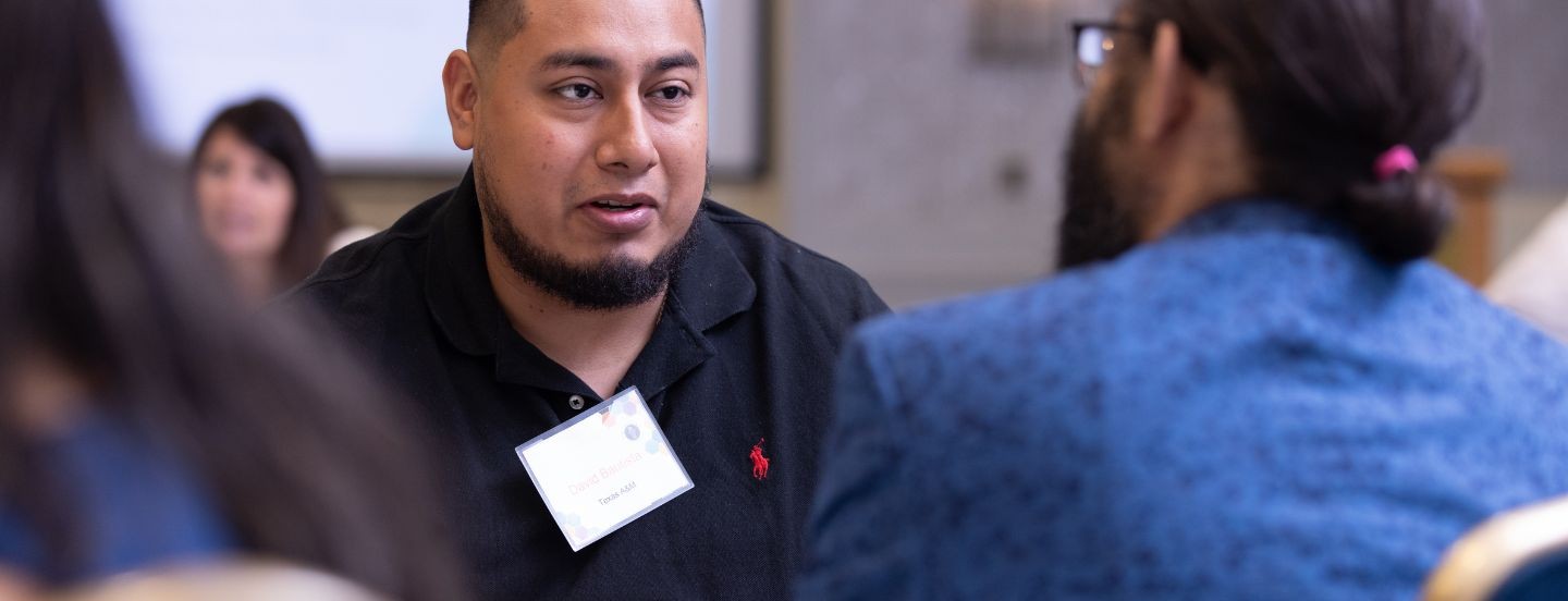 man talking with another person