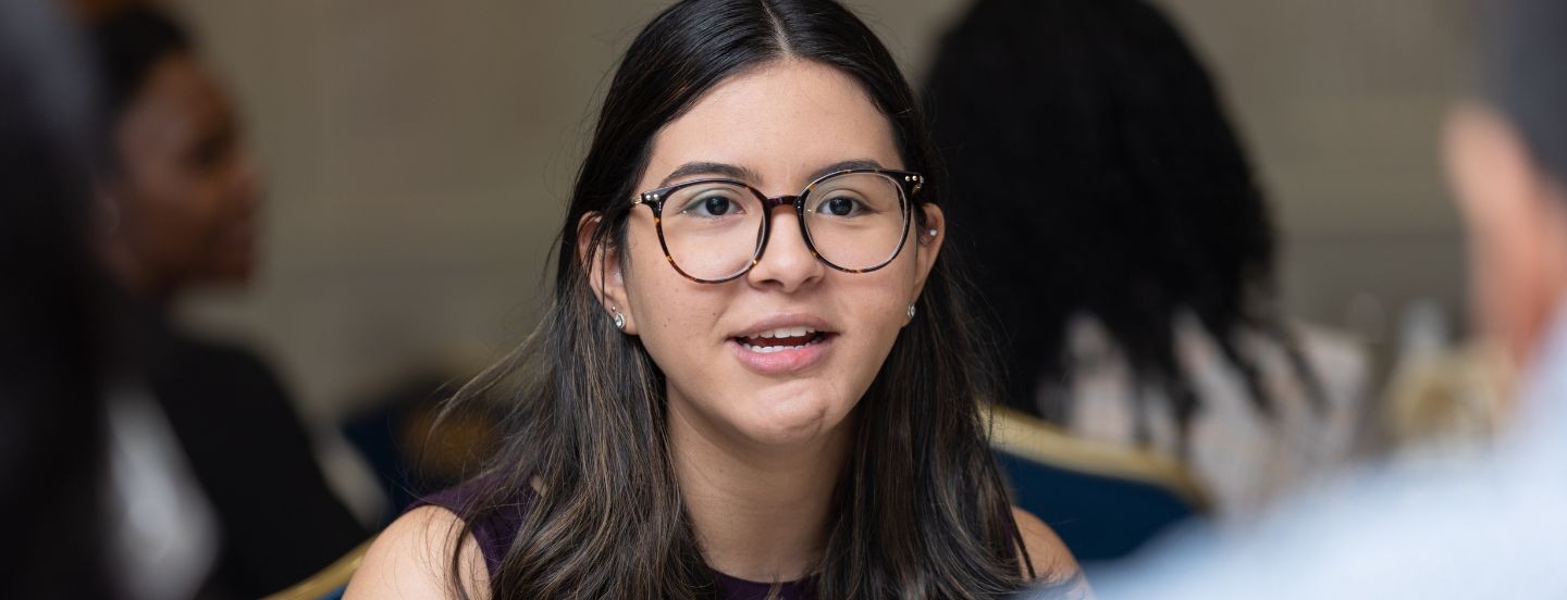 woman in glasses speaking