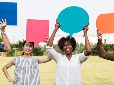 people holding up speech bubbles
