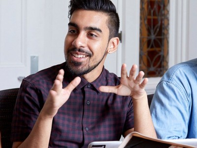 Group of young students working together and discussing
